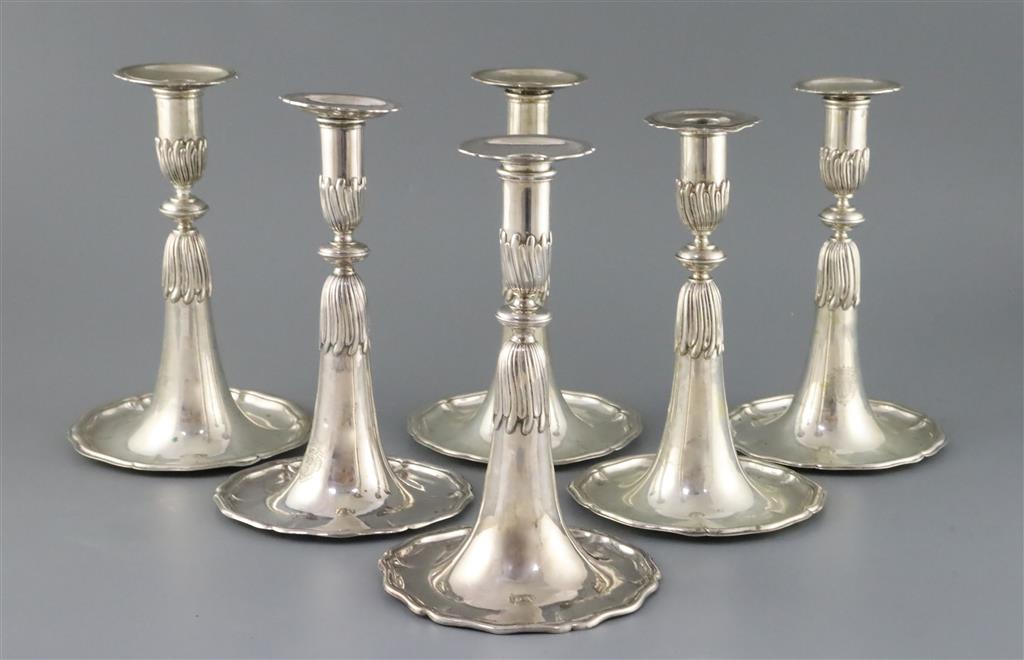 A set of four 18th century Swiss silver candlesticks, and two similar early 19th century silver candlesticks,